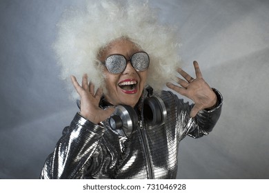 An Amazing Grandma DJ, Older Lady With Headphones, Partying In A Disco Setting