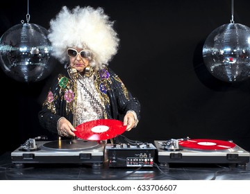 An Amazing Grandma And Grandpa, Older Couple Djing And Partying In A Disco Setting