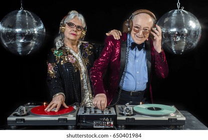 An Amazing Grandma And Grandpa, Older Couple Djing And Partying In A Disco Setting