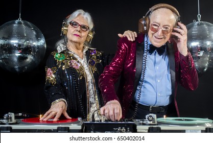 An Amazing Grandma And Grandpa, Older Couple Djing And Partying In A Disco Setting