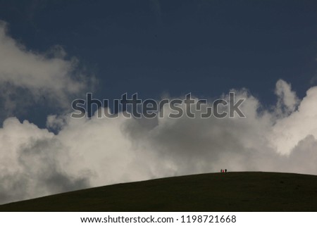 Image, Stock Photo Four people standing in a row on a ridge (2/2)