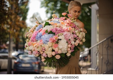 Amazing Huge Bunch Of Different Colorful Fresh Flowers In The Hands Of Young Blonde Woman