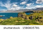 Amazing Icelandic Landscape with rocky coastline and perfect sky. Amazing landsape of Arnarstapi a small village at Snaefellsjokull National Park. Snaefellsnes peninsula in Western Iceland. 