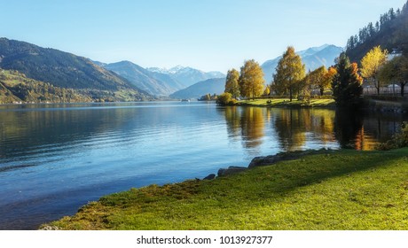 Amazing Landscape Of Alpine Lake With Crystal Clear Green Water And Perfect Blue Sky. Panoramic View Of Beautiful Mountain Landscape In Alps With Zeller Lake In Zell Am See, Salzburger Land, Austria