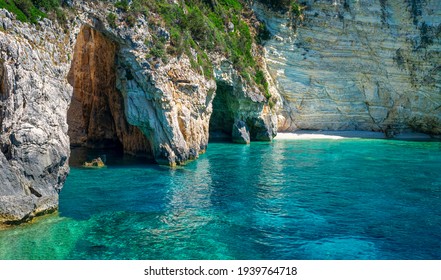 Amazing landscape. The Blue Cave: three exceptional sea caves which are communicating each other. They owe their name to the variety of shades of blue and to the clear waters. Paxos island. Greece.