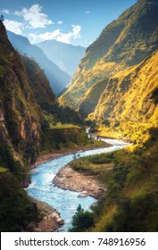 Amazing Landscape With High Himalayan Mountains, Beautiful Curving River, Green Forest, Blue Sky With Clouds And Yellow Sunlight In Autumn In Nepal. Mountain Valley. Travel In Himalayas. Nature