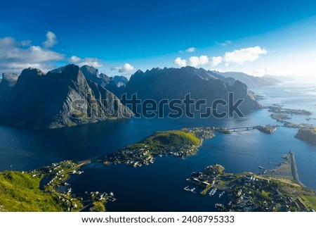 Amazing landscape of the Lofoten Islands from the top of Reinebringen Mountain with blue sky, Norway