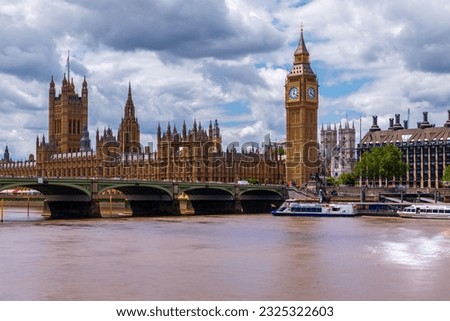 Amazing London cityscape what is included the Big Ben, Goverment's parliament. Westminster abbey's towers is on the background. Thames river and westminster bridge. With tipical english cloudy sky.