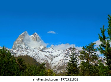 Amazing Mount Ushba With Its Double Summit Against Vivid Blue Sky, Greater Caucasus Range In Svaneti Region, Georgia