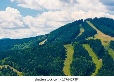 Amazing mountain landscape with blue sky with white clouds, sunny summer day in Bukovel Carpathians, Ukraine. Natural outdoor travel background.
