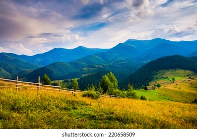 Amazing mountain landscape with fog and a haystack - Shutterstock ID 220658509