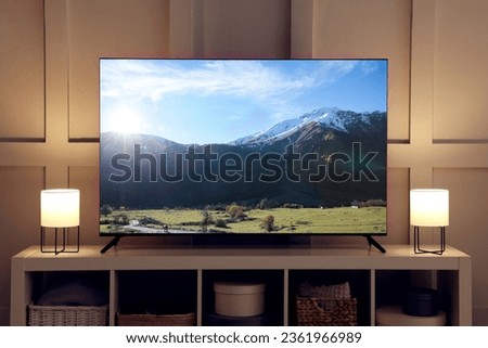 Amazing mountain landscape on TV screen in room