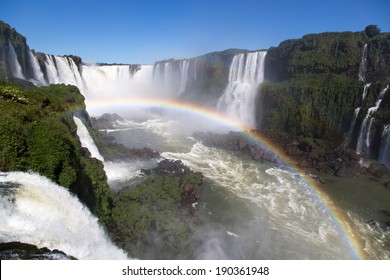 Amazing National Park Of Iguazu Falls With A Full Rainbow Over The Water, Foz Do Iguaçu, Brazil