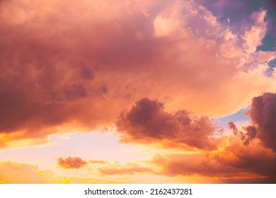 Amazing Natural Bright Dramatic Sky In Different Colours During Sunset Sunrise Time. Colorful Sky Background. Beauty In Nature. Sunset Sky Natural Abstract Background In Pink Purple Yellow Orange