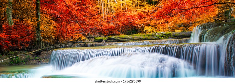 Amazing in nature, beautiful waterfall at colorful autumn forest in fall season, autumn wonderful mood. - Powered by Shutterstock