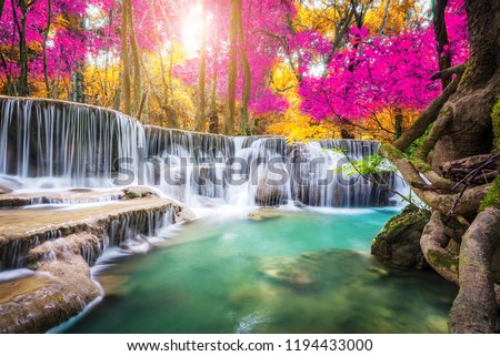 Amazing in nature, beautiful waterfall at colorful autumn forest in fall season