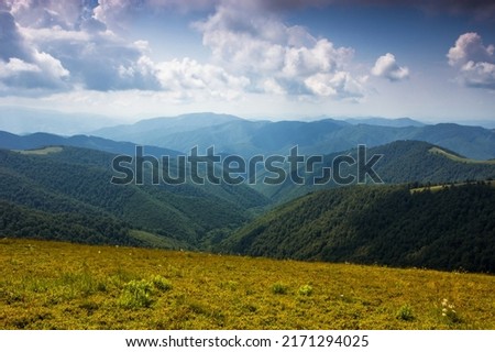 amazing nature landscape in the mountains, morning meadow on background fores and far mountains, location Ukraine, Europe, Carpathian national park