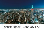 Amazing night view about Mahnattan, New York city, USA. Illuminated streets, buildings in a panoramic photo.