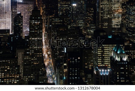 Similar – Skyline of Manhattan at night with skyscrapers lights