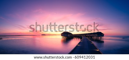 Amazing panorama beach landscape. Maldives sunset seascape view. Horizon with sea and sky. Tranquil scenery, tourism and travel banner