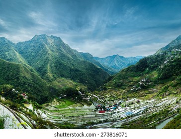 Amazing panorama view of rice terraces fields in Ifugao province mountains under cloudy blue sky. Banaue, Philippines UNESCO heritage - Powered by Shutterstock