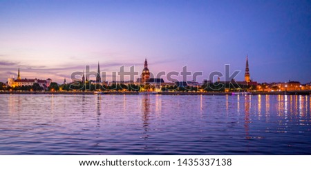 Amazing Panoramic View of the Old Riga City at Sunset Time, The View to Old Town from Daugava River at Night