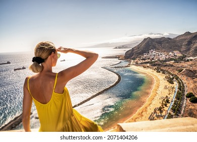 Amazing place to visit. Woman looking at the landscape of Las Teresitas beach and San Andres village, Tenerife, Canary Islands, Spain. Tourism. Vacation. Travel.
