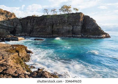 Amazing Rocky Coastline With a Large Cliff, a Cave and Pristine Blue Water During a Warm Sunrise, Devils Kitchen, Noosa National Park, Noosa Heads, Sunshine Coast, Queensland, Australia