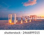 Amazing romantic dinner on colorful sunset beach. Wooden door wedding decoration candles under dream sky. Romance luxury destination dining, exotic table setup sea view. Love arrangement togetherness