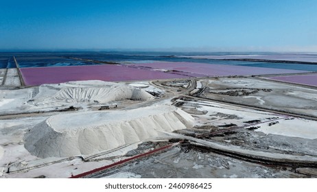 Amazing salt mountain, salt deposit of the Saline de Giraud in Provence in the Camargue Regional Natural Park France. wonders of the Mediterranean and Provence on a sunny day. tourist half for a trip - Powered by Shutterstock