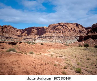 Amazing Sandstone Monoliths In A Barren Desert Prairie On A Blue Partly Cloudy Summer Day At Capitol Reef National Park In Torrey Utah