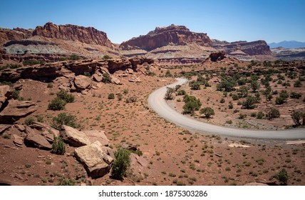 Amazing Sandstone Monoliths In A Barren Desert Prairie On A Blue Partly Cloudy Summer Day At Capitol Reef National Park In Torrey Utah