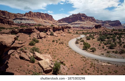 Amazing Sandstone Monoliths In A Barren Desert Prairie On A Blue Partly Cloudy Summer Day At Capitol Reef National Park In Torrey Utah