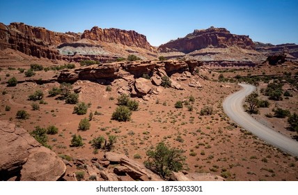 Amazing Sandstone Monoliths In A Barren Desert Prairie On A Blue Partly Cloudy Summer Day At Capitol Reef National Park In Torrey Utah