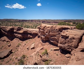 Amazing Sandstone Monoliths In A Barren Desert Prairie On A Blue Partly Cloudy Summer Day At Capitol Reef National Park In Torrey Utah