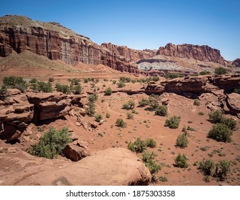 Amazing Sandstone Monoliths In A Barren Desert Prairie On A Blue Partly Cloudy Summer Day At Capitol Reef National Park In Torrey Utah