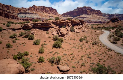 Amazing Sandstone Monoliths In A Barren Desert Prairie On A Blue Partly Cloudy Summer Day At Capitol Reef National Park In Torrey Utah