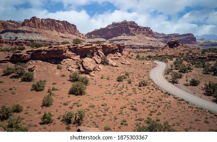 Amazing Sandstone Monoliths In A Barren Desert Prairie On A Blue Partly Cloudy Summer Day At Capitol Reef National Park In Torrey Utah