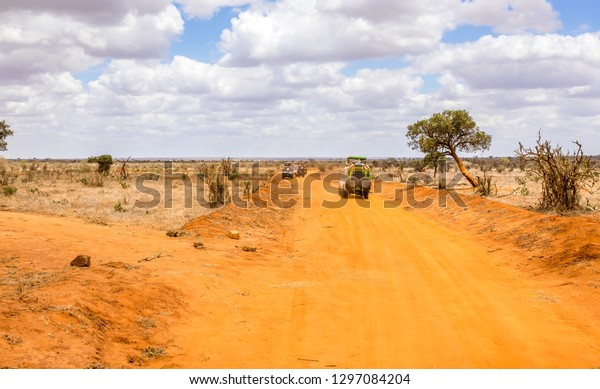 Amazing savannah plains landscape and safari road\
in Kenya