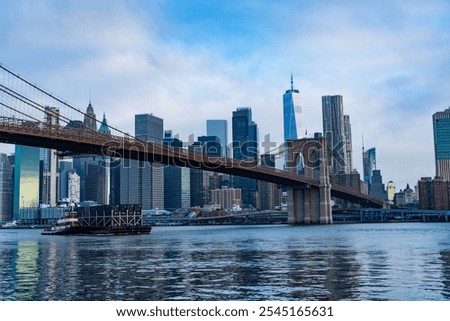 Similar – Image, Stock Photo Brooklyn Bridge over river against city in evening