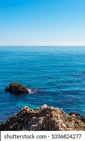 Amazing sea with blue summer wave and rocks, relaxing view of rocks and water, nature