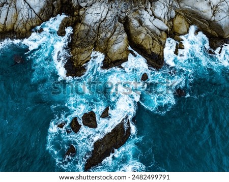 Similar – Aerial Drone View Of Dramatic Ocean Waves Crushing On Rocky Landscape