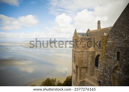 The amazing sight of the bay with low tide, from Mont Saint Michel Abbey walls on a summer day.
