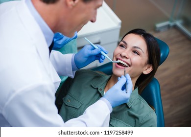 Amazing Smile! Top View Of Dentist Examining His Beautiful Patient In Dentist’s Office
