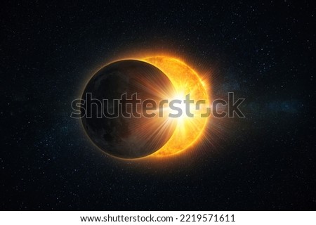 Amazing solar eclipse with yellow rays of light on the starry sky. Sun and moon in space