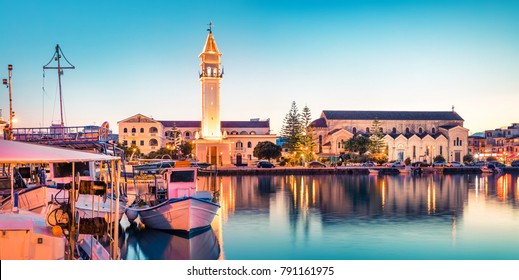 Amazing spring sunset in Zakynthos city. Beautiful evening panorama of town hall and Saint Dionysios Church, Ionian Sea, Zakynthos island, Greece, Europe. Traveling concept background.
