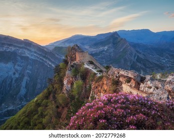 Amazing sunrise at the ancient fortress on the top of the mountain. The Gunib fortress is a historical monument of Dagestan. Russia. 