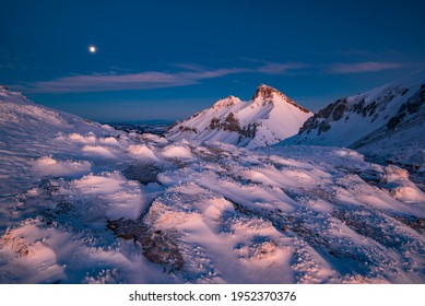 Amazing Sunrise In A Mountain Saddle With Rocks With Icicles And Majestic Mountains In The Background. Winter Sunrise In The Mountains. Vysoke Tatry, Slovakia, High Tatras