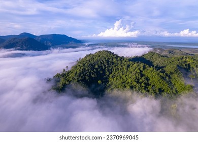 Amazing Sunrise or sunset over mountains hills covered with mist, Aerial view landscape drone shot beautiful colorful nature background