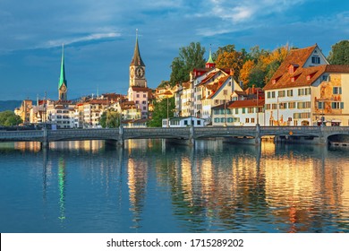Amazing sunrise view on historic Zurich city center with famous Fraumunster and Grossmunster churches and river Limmat, Switzerland